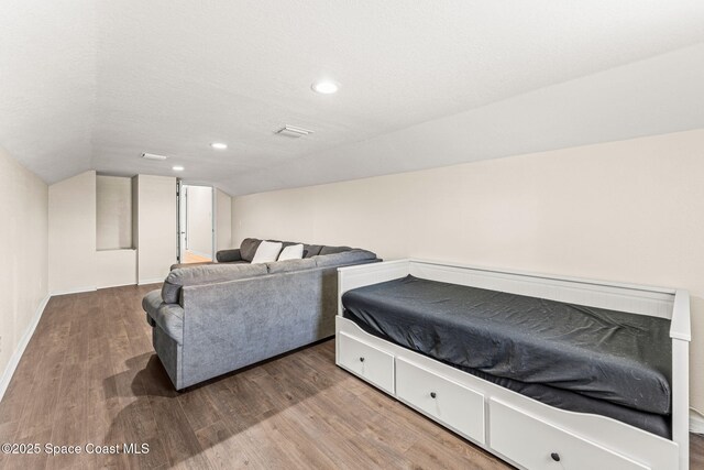 2225 Royal Oaks Dr, Rockledge, FL 32955 - bedroom featuring lofted ceiling, wood finished floors, recessed lighting, and baseboards