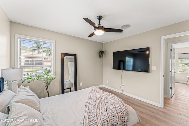 2225 Royal Oaks Dr, Rockledge, FL 32955 - bedroom with light wood finished floors, baseboards, and a ceiling fan