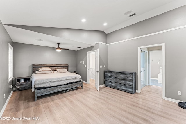 2225 Royal Oaks Dr, Rockledge, FL 32955 - bedroom with wood finished floors, baseboards, vaulted ceiling, and ensuite bath