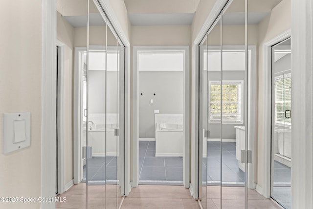2225 Royal Oaks Dr, Rockledge, FL 32955 - corridor with baseboards and light tile patterned floors