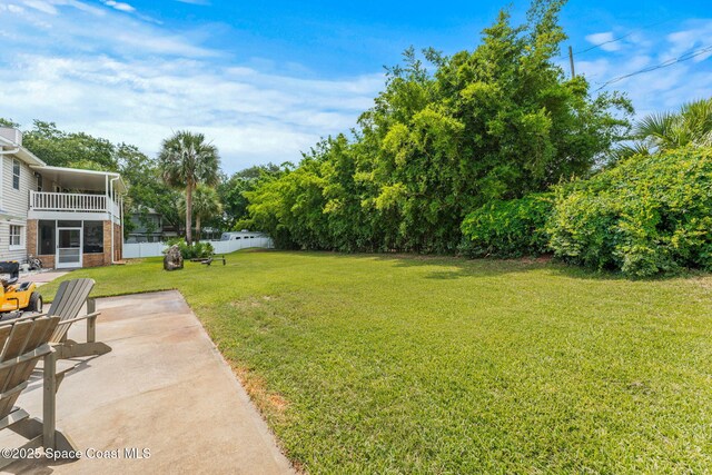 2225 Royal Oaks Dr, Rockledge, FL 32955 - view of yard featuring a patio and a balcony