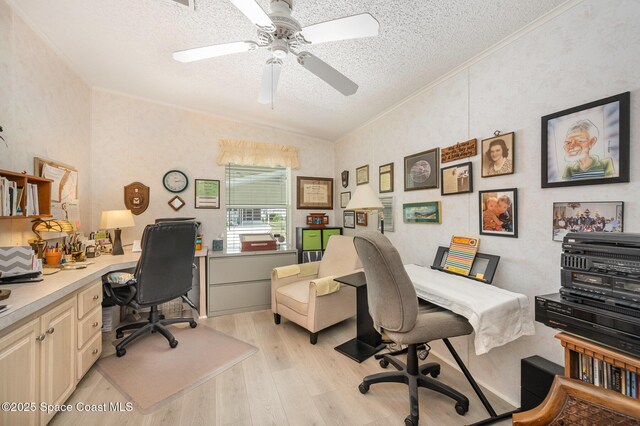 7685 Fox Hunter Cir, Micco, FL 32976 - home office with a textured ceiling, light wood-style floors, a ceiling fan, lofted ceiling, and ornamental molding