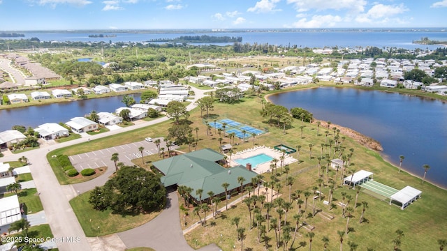 7685 Fox Hunter Cir, Micco, FL 32976 - aerial view of property's location with nearby suburban area, a large body of water, and a pool