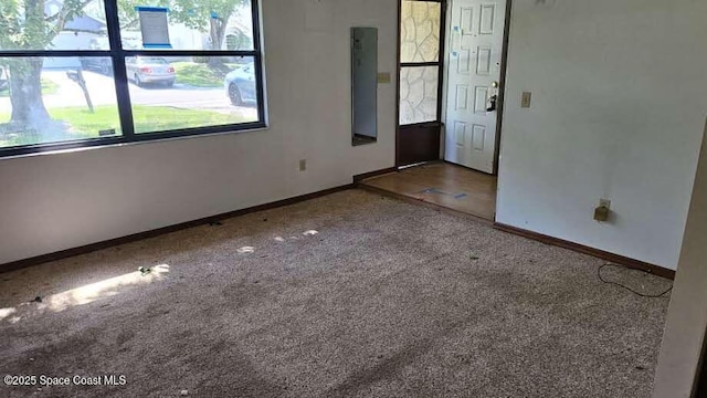 320 Algiers Ave SE, Palm Bay, FL 32909 - spare room featuring baseboards and carpet flooring
