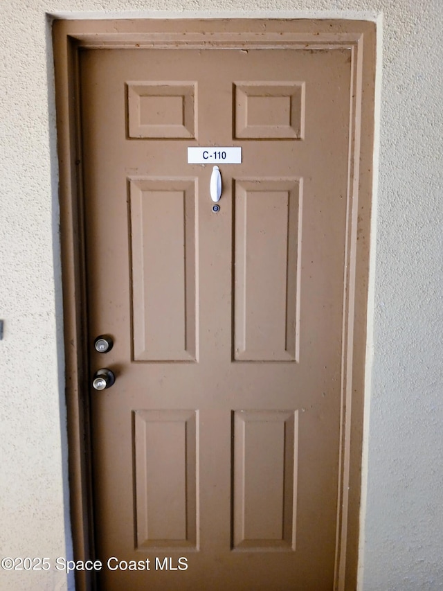 1641 Sunny Brook Ln NE Unit C110, Palm Bay, FL 32905 - property entrance with stucco siding