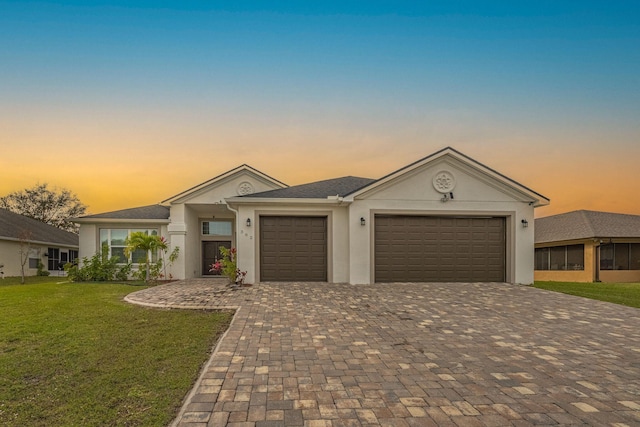 382 Eldron Blvd NE, Palm Bay, FL 32907 - single story home with an attached garage, decorative driveway, a yard, and stucco siding