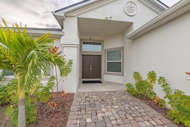 382 Eldron Blvd NE, Palm Bay, FL 32907 - view of exterior entry featuring stucco siding