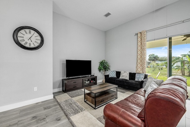 382 Eldron Blvd NE, Palm Bay, FL 32907 - living area with wood finished floors, baseboards, and vaulted ceiling