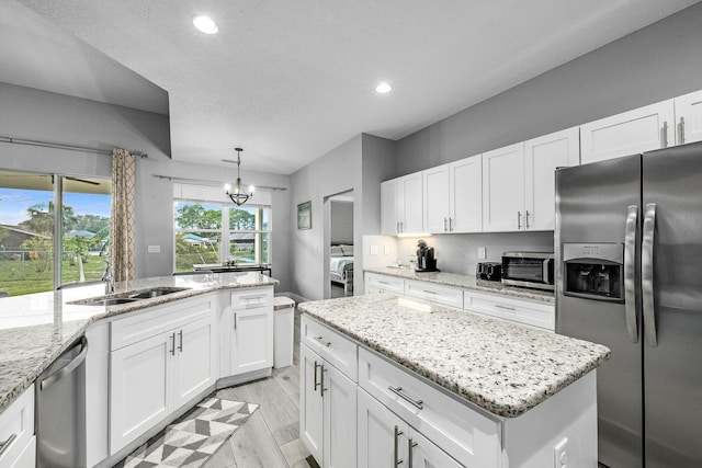 382 Eldron Blvd NE, Palm Bay, FL 32907 - kitchen featuring appliances with stainless steel finishes, a sink, recessed lighting, and white cabinets