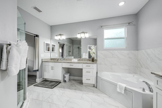 382 Eldron Blvd NE, Palm Bay, FL 32907 - full bath with a stall shower, a garden tub, vanity, marble finish flooring, and recessed lighting
