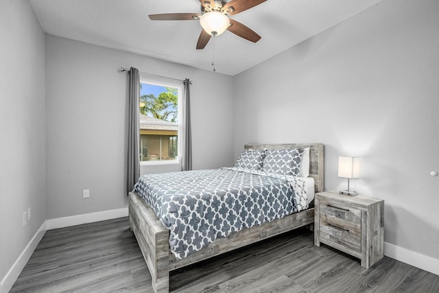 382 Eldron Blvd NE, Palm Bay, FL 32907 - bedroom featuring baseboards, wood finished floors, and a ceiling fan