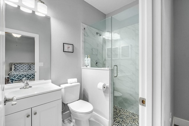 382 Eldron Blvd NE, Palm Bay, FL 32907 - ensuite bathroom featuring toilet, a marble finish shower, and vanity