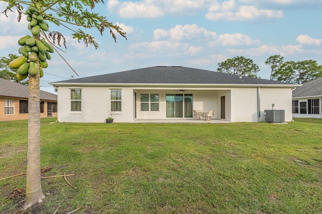 382 Eldron Blvd NE, Palm Bay, FL 32907 - rear view of house with central AC unit, ceiling fan, stucco siding, a patio, and a lawn