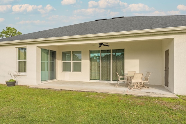 382 Eldron Blvd NE, Palm Bay, FL 32907 - back of house with a ceiling fan, a patio area, a yard, and roof with shingles