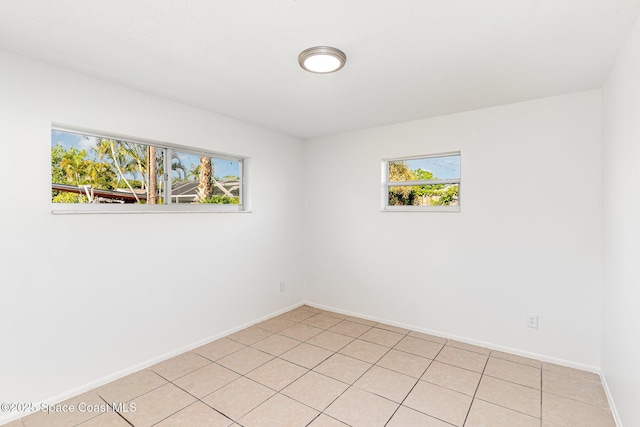 2885 Fountainhead Blvd, Melbourne, FL 32935 - spare room featuring plenty of natural light and light tile patterned floors
