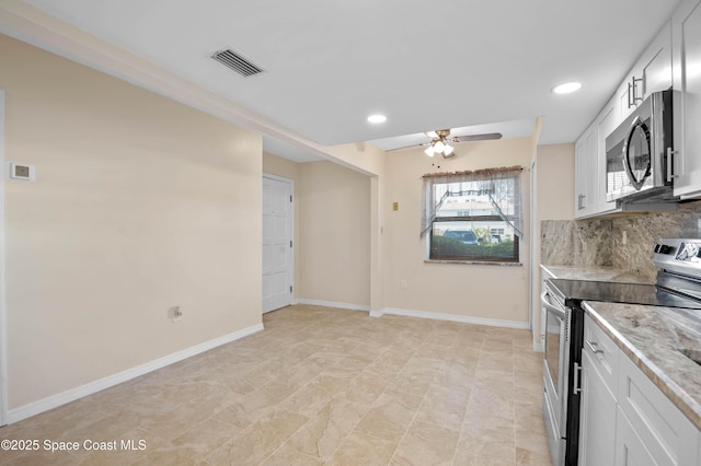 5630 N Banana River Blvd Unit 1, Cocoa Beach, FL 32931 - kitchen featuring stainless steel appliances, ceiling fan, backsplash, white cabinetry, and recessed lighting