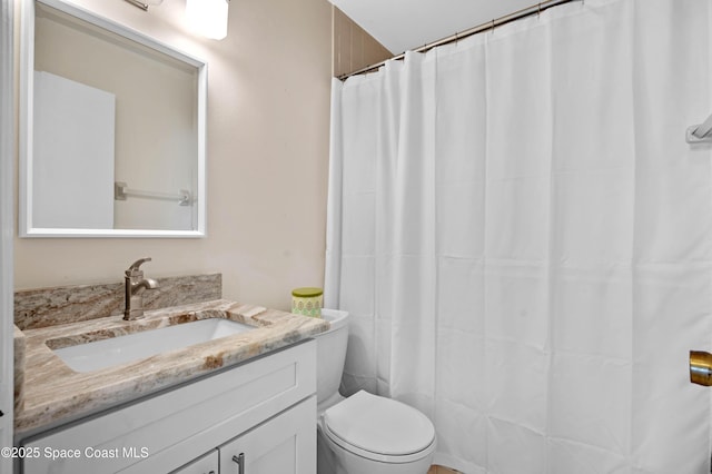 5630 N Banana River Blvd Unit 1, Cocoa Beach, FL 32931 - bathroom with toilet, vanity, and a shower with curtain