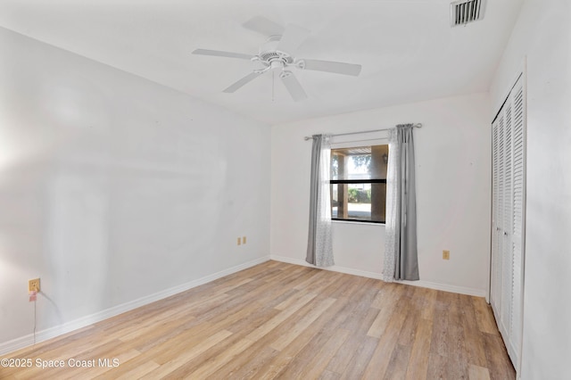 5630 N Banana River Blvd Unit 1, Cocoa Beach, FL 32931 - unfurnished bedroom featuring light wood-style floors, baseboards, a closet, and ceiling fan