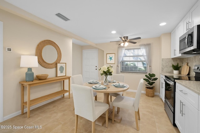 5630 N Banana River Blvd Unit 1, Cocoa Beach, FL 32931 - dining area with ceiling fan, recessed lighting, baseboards, and light tile patterned flooring