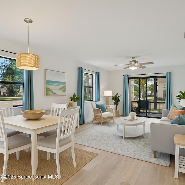 5630 N Banana River Blvd Unit 1, Cocoa Beach, FL 32931 - dining area featuring plenty of natural light, light wood-style floors, and ceiling fan