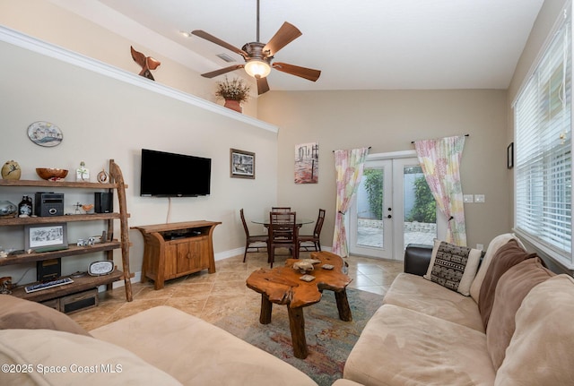 210 Sutton St, Rockledge, FL 32955 - living area featuring a ceiling fan, light tile patterned floors, french doors, baseboards, and lofted ceiling