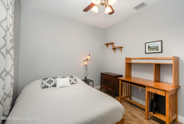 210 Sutton St, Rockledge, FL 32955 - bedroom featuring wood finished floors, baseboards, and ceiling fan