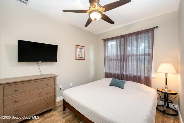 210 Sutton St, Rockledge, FL 32955 - bedroom featuring light wood-type flooring, baseboards, and ceiling fan