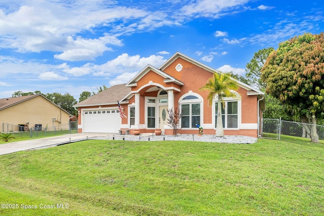 1398 Stuttgart Ave NW, Palm Bay, FL 32907 - view of front of home with driveway, a garage, and stucco siding