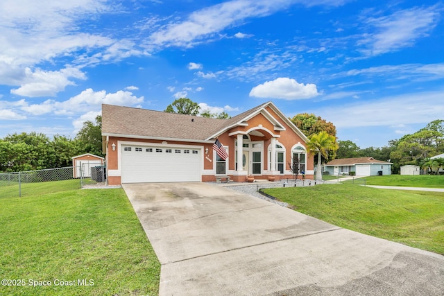 1398 Stuttgart Ave NW, Palm Bay, FL 32907 - view of front of house featuring driveway, a garage, stucco siding, a gate, and a shingled roof