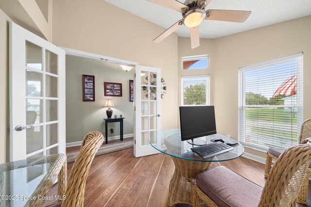 1398 Stuttgart Ave NW, Palm Bay, FL 32907 - office area featuring french doors, wood finished floors, baseboards, and ceiling fan