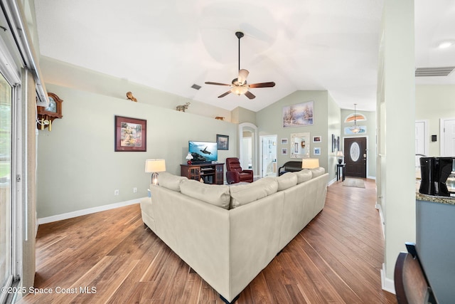 1398 Stuttgart Ave NW, Palm Bay, FL 32907 - living area with wood finished floors, a ceiling fan, lofted ceiling, and baseboards