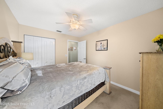 1398 Stuttgart Ave NW, Palm Bay, FL 32907 - bedroom with carpet flooring, baseboards, a closet, and a ceiling fan