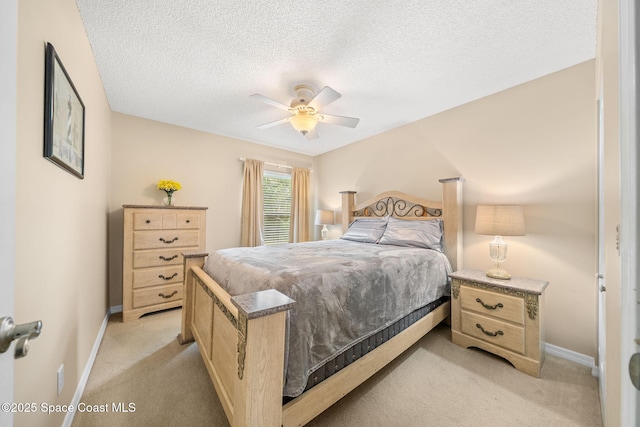 1398 Stuttgart Ave NW, Palm Bay, FL 32907 - bedroom with light carpet, baseboards, a textured ceiling, and a ceiling fan