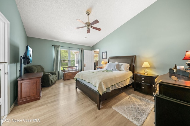 1398 Stuttgart Ave NW, Palm Bay, FL 32907 - bedroom with lofted ceiling, light wood-type flooring, a textured ceiling, and ceiling fan