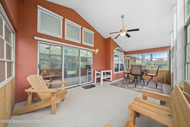 1398 Stuttgart Ave NW, Palm Bay, FL 32907 - sunroom featuring ceiling fan, carpet floors, outdoor dining area, and high vaulted ceiling