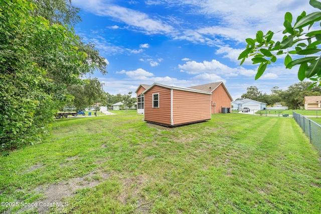 1398 Stuttgart Ave NW, Palm Bay, FL 32907 - view of yard featuring central AC unit and an outbuilding