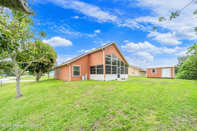 1398 Stuttgart Ave NW, Palm Bay, FL 32907 - back of house featuring stucco siding and a sunroom