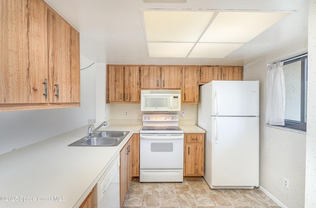 1714 University Ln Unit 201, Cocoa, FL 32922 - kitchen featuring white appliances, a sink, and light countertops