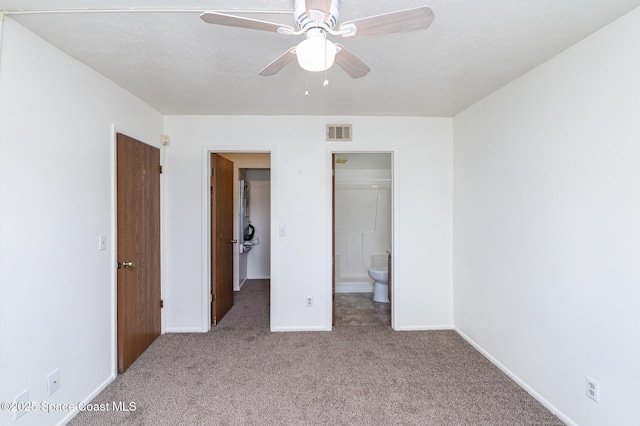 1714 University Ln Unit 201, Cocoa, FL 32922 - unfurnished bedroom with carpet, baseboards, connected bathroom, and a ceiling fan