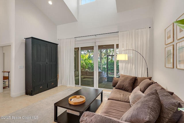 1629 Baseline Ln, Vero Beach, FL 32967 - tiled living area featuring a towering ceiling, plenty of natural light, baseboards, and recessed lighting