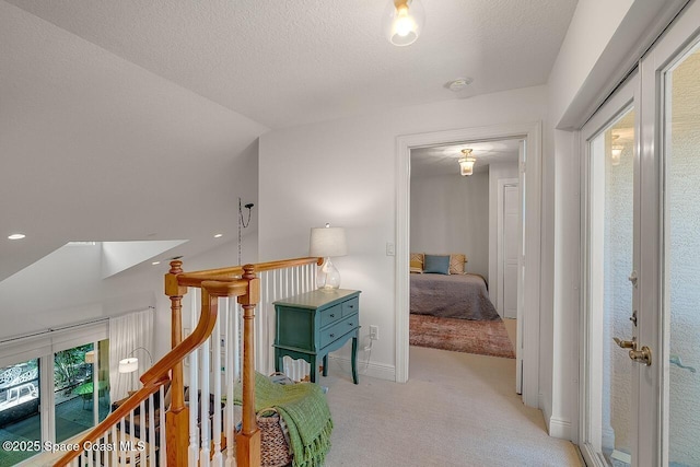 1629 Baseline Ln, Vero Beach, FL 32967 - corridor featuring light carpet, an upstairs landing, and baseboards