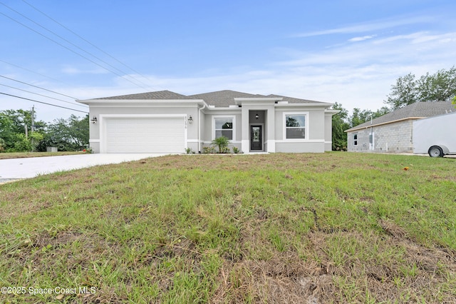 8286 100th Ave, Vero Beach, FL 32967 - prairie-style house with a garage, stucco siding, a front lawn, and driveway