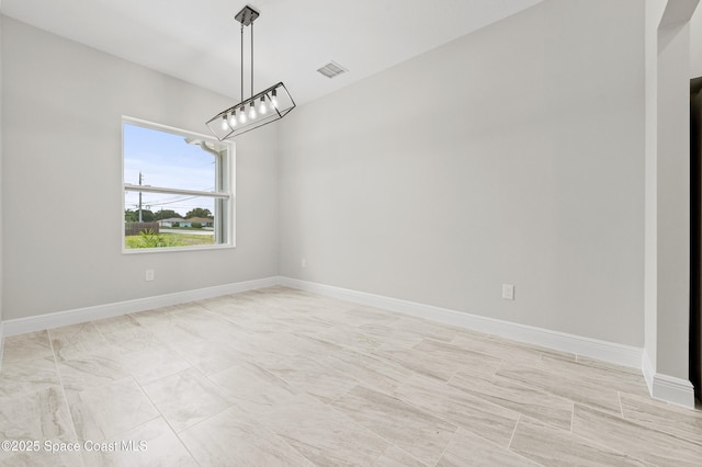 8286 100th Ave, Vero Beach, FL 32967 - spare room featuring baseboards