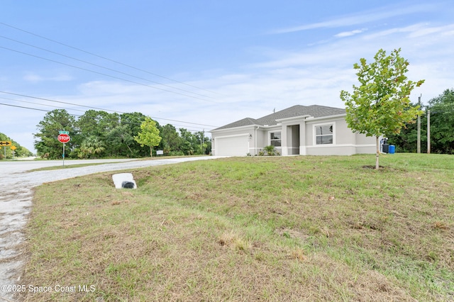8286 100th Ave, Vero Beach, FL 32967 - ranch-style house featuring concrete driveway, an attached garage, a front lawn, and stucco siding