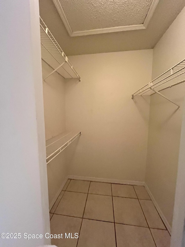 110 Summer Pl Unit 4, Merritt Island, FL 32953 - spacious closet featuring tile patterned flooring