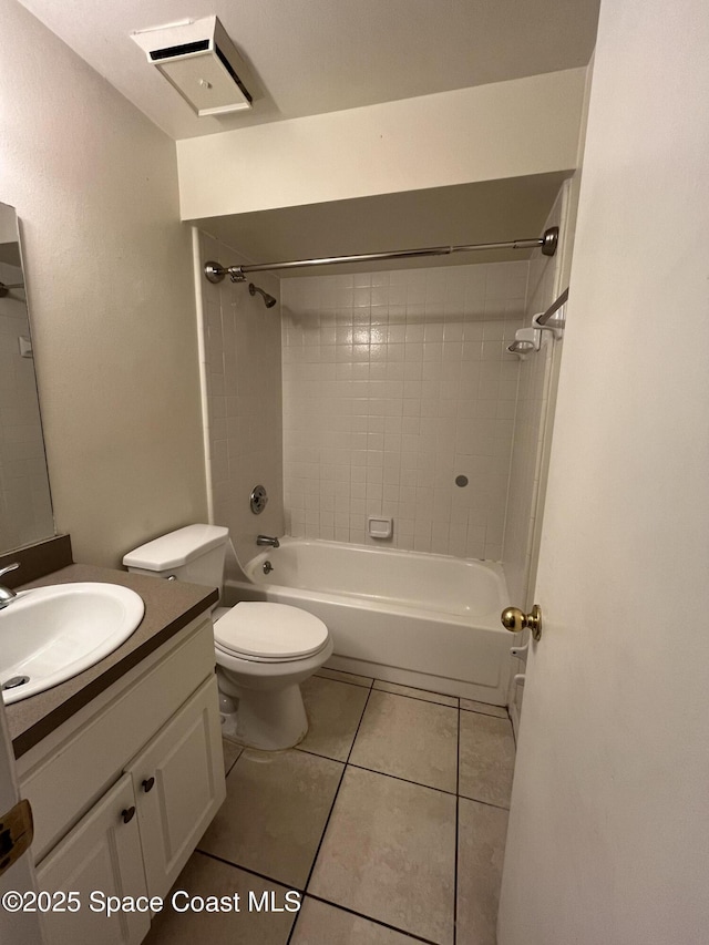 110 Summer Pl Unit 4, Merritt Island, FL 32953 - bathroom featuring vanity, toilet, shower / bath combination, and tile patterned flooring