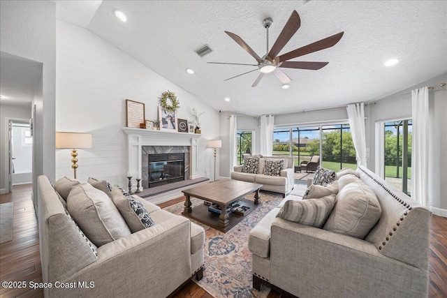 912 Hialeah St, Rockledge, FL 32955 - living room with vaulted ceiling, a textured ceiling, ceiling fan, wood finished floors, and recessed lighting