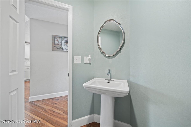 912 Hialeah St, Rockledge, FL 32955 - bathroom with wood finished floors and baseboards