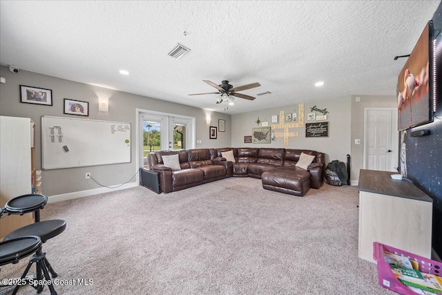 912 Hialeah St, Rockledge, FL 32955 - living area featuring carpet floors, a textured ceiling, ceiling fan, french doors, and baseboards