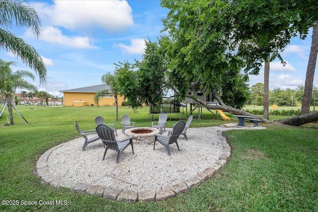 912 Hialeah St, Rockledge, FL 32955 - view of green lawn with an outdoor fire pit